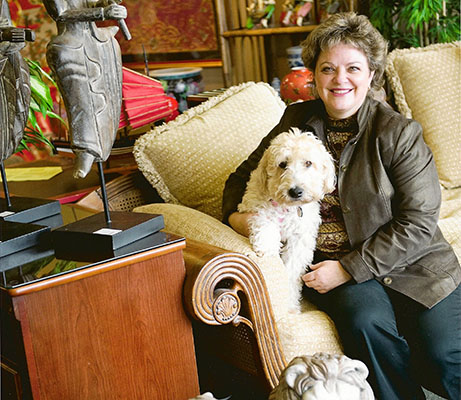 Kay and her dog smiling at camera