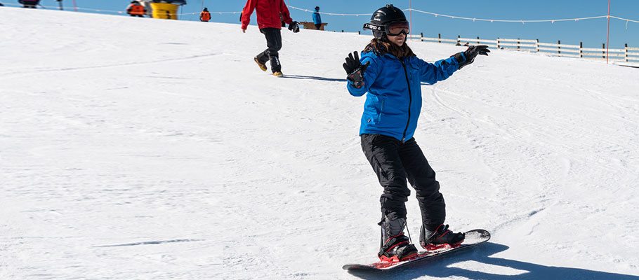 Person snowboarding down a hill