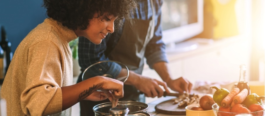 Young woman cooking in kitchen