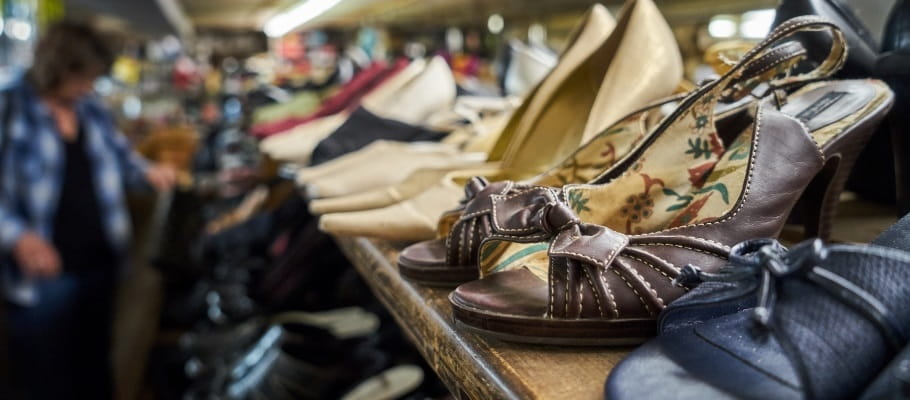 Shoes on a shelf at a thrift store