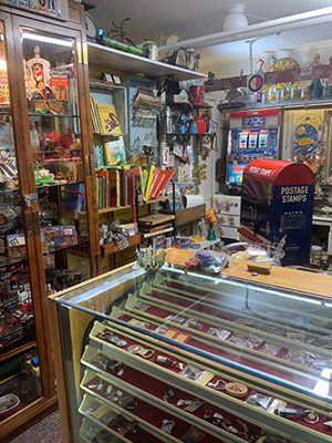 Antique display showing small items in a glass case