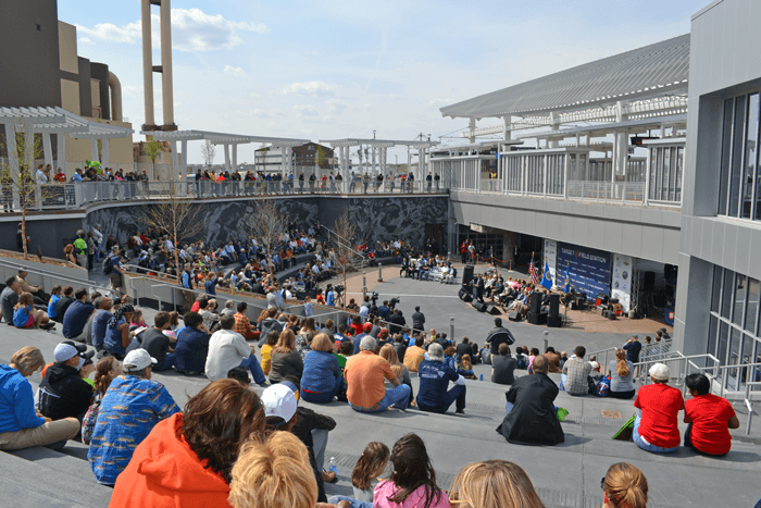 A photo of a large crowd enjoying a performance.