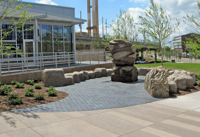 A photo of the marble and rock sculpture by Zoran Mojsilov on a nice summer day.